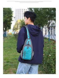 Rear view of a blue and grey waterproof crossbody chest bag with adjustable strap