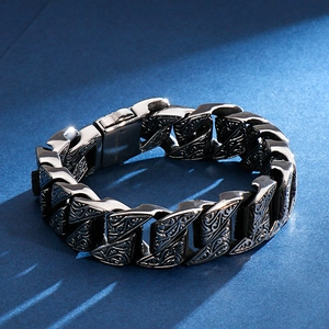 Detailed close-up of retro engraved floral patterns on a 304 stainless steel men's bracelet