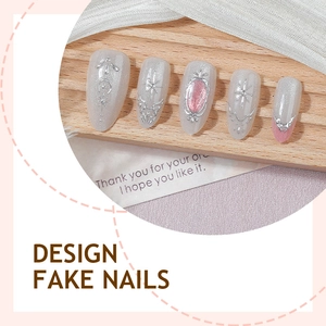 Cat eye almond fake nails with silver metal bow and pink gem stones in vintage style