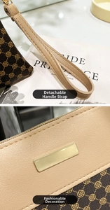 Detail of detachable wrist strap and golden metal hardware on brown textured purse