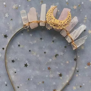 Detail of handmade gold crescent moon tiara with pink crystals and wired finish