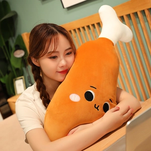 Soft cartoon chicken leg plush pillow held by a girl in a cozy home bedroom setting