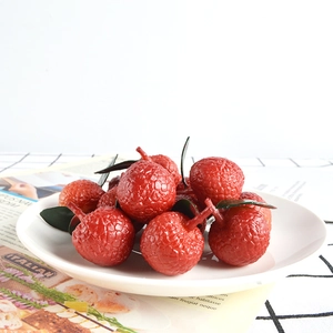 Realistic artificial lychees with green leaves on white plate for home kitchen decor