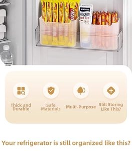 Close-up of durable transparent plastic organizer boxes for refrigerator side door