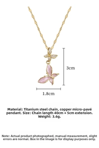 Detailed view of pink enamel butterfly pendant with zirconia inlay and 45cm chain length