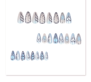 Detailed set of 24 blue and white gradient almond press-on nails with silver Y2K patterns