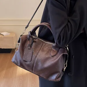 Retro dark brown pebbled leather Boston bag with handles and adjustable shoulder strap