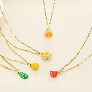 Gold stainless steel fruit pendant necklaces featuring avocado, durian, and pineapple styles