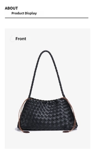 Macro detail of hand-woven black leather texture with brown decorative rope accents