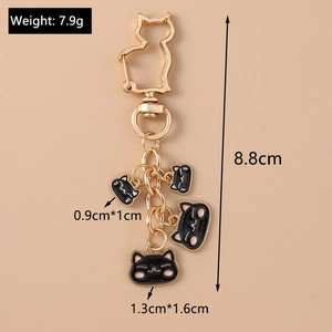 Detailed size parameters of golden cat keychain with black pendants and 8.8cm total length