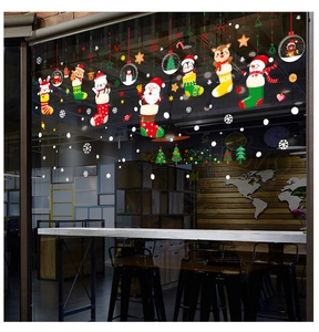 Detailed Christmas window decals showing Santa, reindeer, and snowman on glass