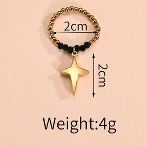 Beaded stretch ring with black faceted stones and gold star pendant dimensions detail