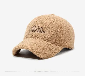 Side view of camel faux shearling baseball cap with Hello Weekend embroidery