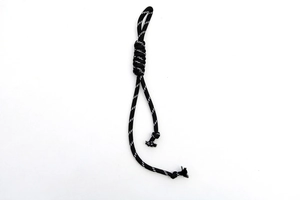 Detailed view of the black and white braided nylon cord with adjustable knotted weave texture