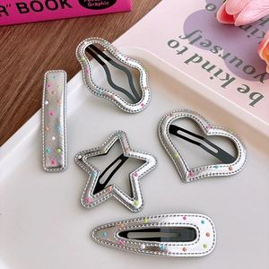 Five-piece silver faux leather hair clip set with colorful polka dots in various shapes