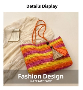 Detail of colorful striped woven tote bag with orange handles and tassel on white dress