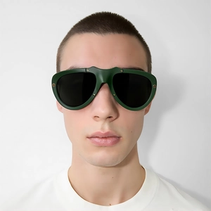 Fashionable oversized aviator sunglasses with green matte frames and black lenses on model