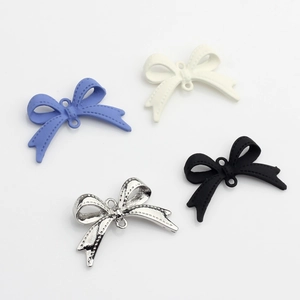 Solid color alloy bow pendants for DIY jewelry making in blue, white, and silver
