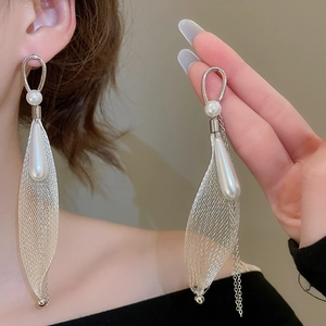 Silver grid pearl drop tassel earrings showing elegant cascading design on a model