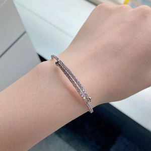 Detail of S925 sterling silver double-layer bracelet with sparkling zircon stones