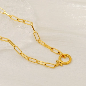 Close-up of 18K gold plated paperclip chain necklace with a round spring clasp detail