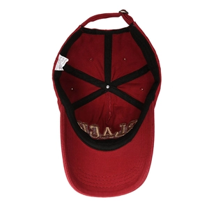 Internal view of burgundy baseball cap featuring six-panel design and metal buckle