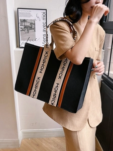 Large black felt tote bag with letter printed handles and contrast beige straps