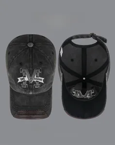 Detail of vintage washed denim baseball cap featuring high-density 3D M letter embroidery