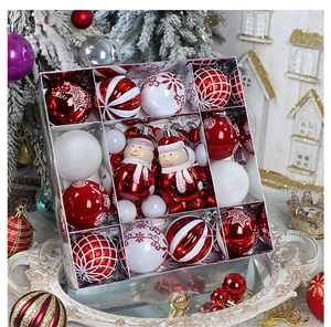 Detailed set of red and white Christmas ornaments with painted balls and Santa figurines