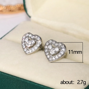Elegant 11mm silver heart stud earrings with cubic zirconia in green jewelry box