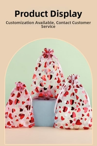 Three sizes of heart-printed organza drawstring gift bags with silver and red patterns