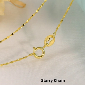 Close-up of gold S925 sterling silver star chain necklace with spring ring clasp