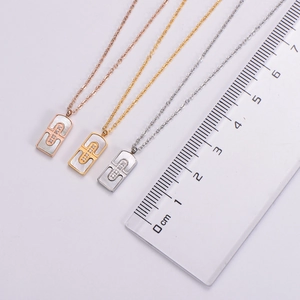 Detailed comparison of rectangular shell pendants in gold, silver, and rose gold finishes