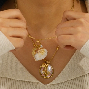 Double-layered gold stainless steel necklace with shell starfish and pink enamel charm