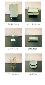Detailed grid of jewelry display stands and boxes with dimensions in gray velvet and gold