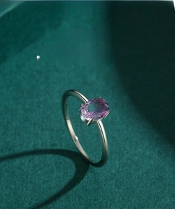 Macro detail of S925 silver ring featuring an oval purple gradient tourmaline stone