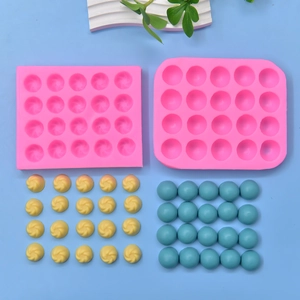 Pink 20-cavity silicone mold set for hemisphere and spiral chocolates or mini cakes