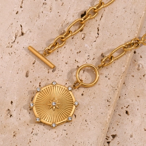 18K gold plated stainless steel sunburst pendant necklace with toggle clasp and stones