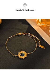Detail of star and moon celestial charm on 14K gold-plated stainless steel chain