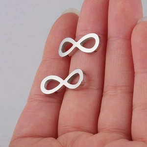 Close-up of infinity symbol jewelry connectors in mirror polished stainless steel on hand