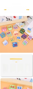 Detail of cute acrylic brooch with motivational quotes and cartoon illustrations