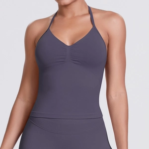 Detail of dark purple seamless yoga halter top with V-neckline and front pleat texture