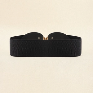 Detail of a black elastic waist belt featuring an elegant gold peach blossom buckle