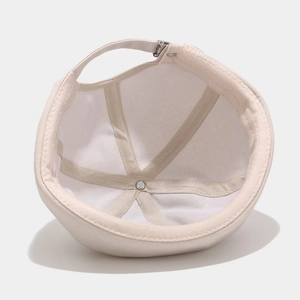 Beige cotton miki hat showing interior six-panel stitching and adjustable metal buckle