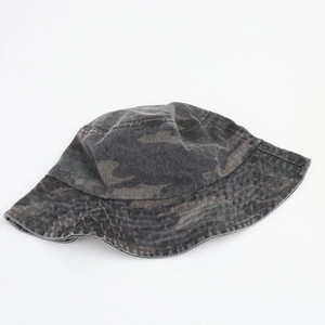 Close-up of vintage washed camouflage bucket hat with durable stitching and cotton texture