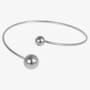 Macro shot of silver-tone stainless steel open cuff bracelet with minimalist bead accents