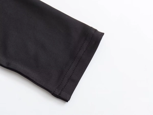 Detailed close-up of the black nylon dress cuff showing high-quality knitted texture