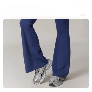 Detail of high waist yoga flare pants featuring a split hem to elongate leg lines