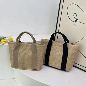 Minimalist straw tote bags with khaki and black woven handles and tulip decor