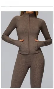 Detailed rock brown athletic set featuring a zip-up jacket with thumbholes and leggings